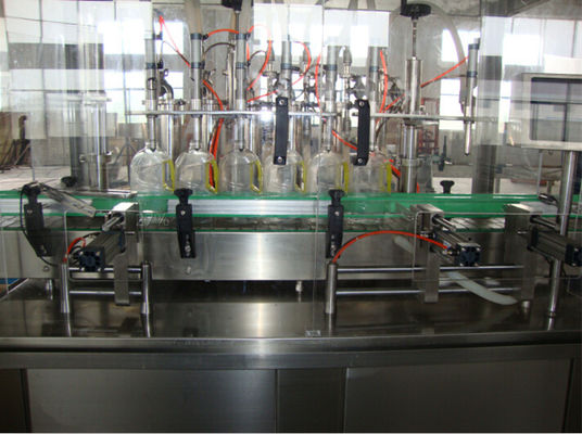Équipement de mise en bouteilles d'eau en bouteille de remplissage d'huile à grande vitesse de machine complètement automatique